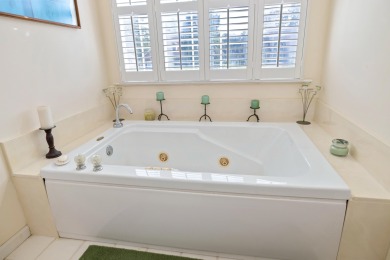 Welcome to this stunning 3-bedroom, 2.5-bathroom waterfront home on Players Course At Wyboo Plantation in South Carolina - for sale on GolfHomes.com, golf home, golf lot