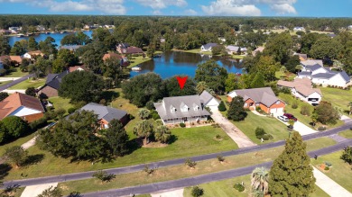Welcome to this stunning 3-bedroom, 2.5-bathroom waterfront home on Players Course At Wyboo Plantation in South Carolina - for sale on GolfHomes.com, golf home, golf lot