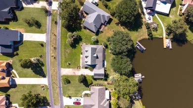 Welcome to this stunning 3-bedroom, 2.5-bathroom waterfront home on Players Course At Wyboo Plantation in South Carolina - for sale on GolfHomes.com, golf home, golf lot