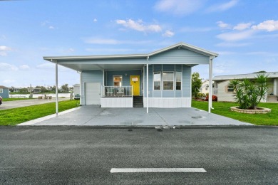 Discover resort-style living on the scenic shores of Lake on Blue Cypress Golf and RV Resort in Florida - for sale on GolfHomes.com, golf home, golf lot