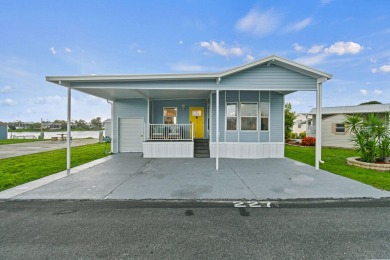Discover resort-style living on the scenic shores of Lake on Blue Cypress Golf and RV Resort in Florida - for sale on GolfHomes.com, golf home, golf lot