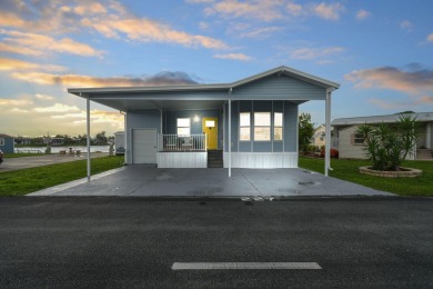 Discover resort-style living on the scenic shores of Lake on Blue Cypress Golf and RV Resort in Florida - for sale on GolfHomes.com, golf home, golf lot