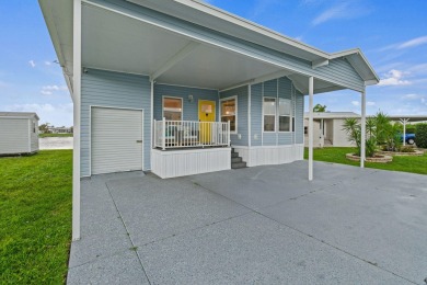 Discover resort-style living on the scenic shores of Lake on Blue Cypress Golf and RV Resort in Florida - for sale on GolfHomes.com, golf home, golf lot
