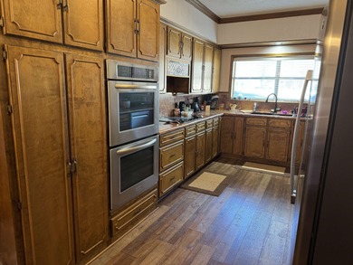 Situated in the heart of Rayburn Country, this elegant golf on Rayburn Country Club in Texas - for sale on GolfHomes.com, golf home, golf lot