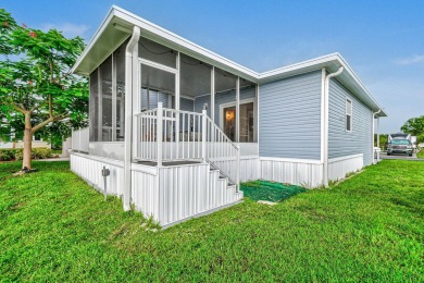 Discover resort-style living on the scenic shores of Lake on Blue Cypress Golf and RV Resort in Florida - for sale on GolfHomes.com, golf home, golf lot