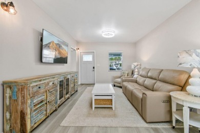 Discover resort-style living on the scenic shores of Lake on Blue Cypress Golf and RV Resort in Florida - for sale on GolfHomes.com, golf home, golf lot