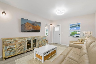Discover resort-style living on the scenic shores of Lake on Blue Cypress Golf and RV Resort in Florida - for sale on GolfHomes.com, golf home, golf lot