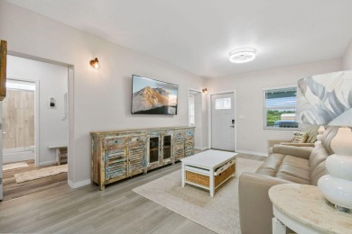 Discover resort-style living on the scenic shores of Lake on Blue Cypress Golf and RV Resort in Florida - for sale on GolfHomes.com, golf home, golf lot