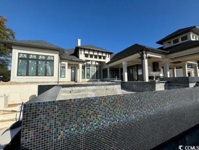 Amazing single story plan being built directly on the waterway on Barefoot Resort and Golf Club - Fazio Course in South Carolina - for sale on GolfHomes.com, golf home, golf lot