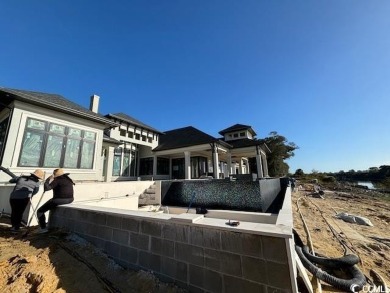 Amazing single story plan being built directly on the waterway on Barefoot Resort and Golf Club - Fazio Course in South Carolina - for sale on GolfHomes.com, golf home, golf lot