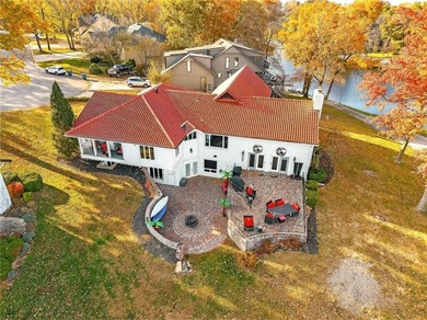 Experience the WOW factor of this beautiful lakefront property on Lakewood Oaks Golf Club, Ltd. in Missouri - for sale on GolfHomes.com, golf home, golf lot