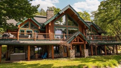 Welcome to this stunning Up North luxury log home perfectly on Boyne Mountain Resort - Monument Course in Michigan - for sale on GolfHomes.com, golf home, golf lot