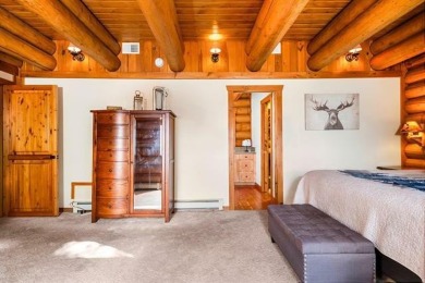 Welcome to this stunning Up North luxury log home perfectly on Boyne Mountain Resort - Monument Course in Michigan - for sale on GolfHomes.com, golf home, golf lot