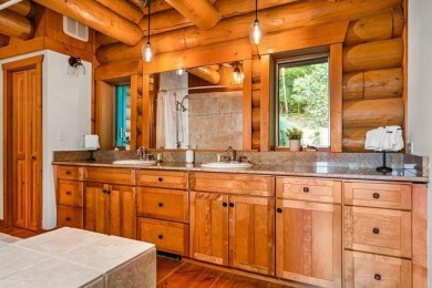 Welcome to this stunning Up North luxury log home perfectly on Boyne Mountain Resort - Monument Course in Michigan - for sale on GolfHomes.com, golf home, golf lot