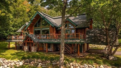 Welcome to this stunning Up North luxury log home perfectly on Boyne Mountain Resort - Monument Course in Michigan - for sale on GolfHomes.com, golf home, golf lot