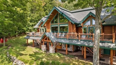 Welcome to this stunning Up North luxury log home perfectly on Boyne Mountain Resort - Monument Course in Michigan - for sale on GolfHomes.com, golf home, golf lot