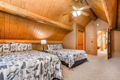 Welcome to this stunning Up North luxury log home perfectly on Boyne Mountain Resort - Monument Course in Michigan - for sale on GolfHomes.com, golf home, golf lot