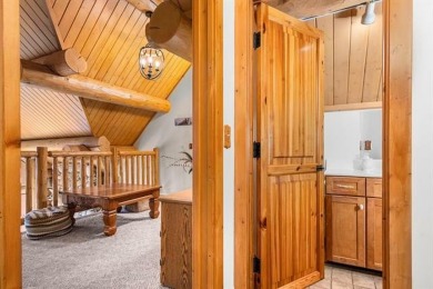 Welcome to this stunning Up North luxury log home perfectly on Boyne Mountain Resort - Monument Course in Michigan - for sale on GolfHomes.com, golf home, golf lot