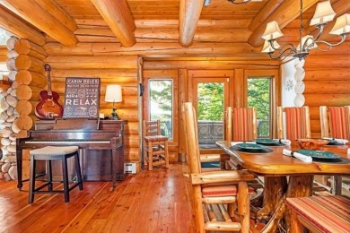 Welcome to this stunning Up North luxury log home perfectly on Boyne Mountain Resort - Monument Course in Michigan - for sale on GolfHomes.com, golf home, golf lot