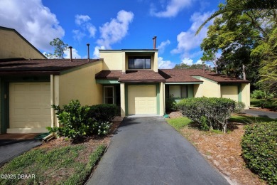 Nestled in the highly sought-after Sugar Mill Golf Townhomes on Sugar Mill Country Club in Florida - for sale on GolfHomes.com, golf home, golf lot