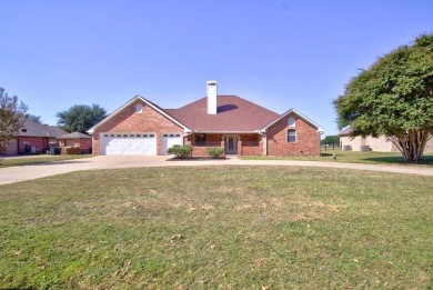This exceptionally-updated 3 bedroom, 3 bathroom brick home in on Cedar Creek Country Club in Texas - for sale on GolfHomes.com, golf home, golf lot