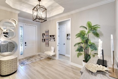 PREPARE TO FALL IN LOVE with this meticulously maintained GOLF on Lakewood National Golf Club in Florida - for sale on GolfHomes.com, golf home, golf lot