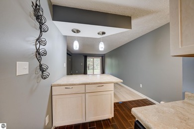 This turnkey lower level condo on 6th fairway of The Crown Golf on Bay Meadows Golf Course - Executive in Michigan - for sale on GolfHomes.com, golf home, golf lot