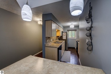 This turnkey lower level condo on 6th fairway of The Crown Golf on Bay Meadows Golf Course - Executive in Michigan - for sale on GolfHomes.com, golf home, golf lot