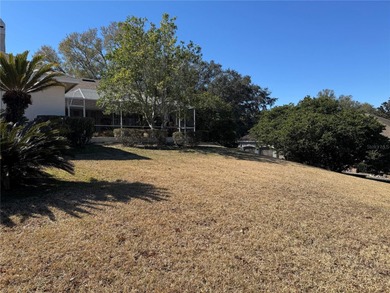 This elegant, spacious residence is set on a beautifully on Harbor Hills Country Club in Florida - for sale on GolfHomes.com, golf home, golf lot