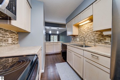 This turnkey lower level condo on 6th fairway of The Crown Golf on Bay Meadows Golf Course - Executive in Michigan - for sale on GolfHomes.com, golf home, golf lot