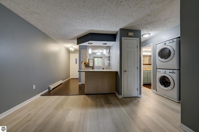 This turnkey lower level condo on 6th fairway of The Crown Golf on Bay Meadows Golf Course - Executive in Michigan - for sale on GolfHomes.com, golf home, golf lot