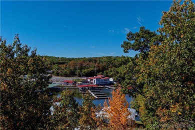 This beautiful 4-bedroom home offers great water views from one on The Oaks Golf Course in Missouri - for sale on GolfHomes.com, golf home, golf lot