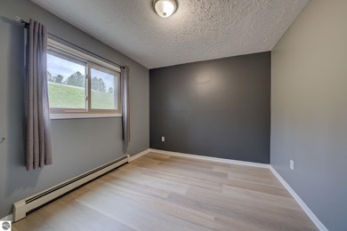 This turnkey lower level condo on 6th fairway of The Crown Golf on Bay Meadows Golf Course - Executive in Michigan - for sale on GolfHomes.com, golf home, golf lot