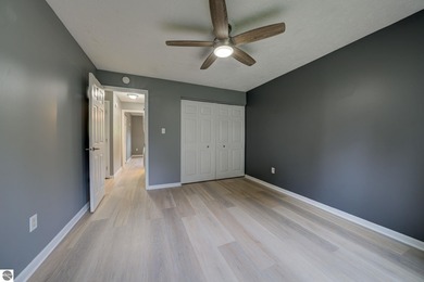 This turnkey lower level condo on 6th fairway of The Crown Golf on Bay Meadows Golf Course - Executive in Michigan - for sale on GolfHomes.com, golf home, golf lot