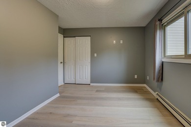 This turnkey lower level condo on 6th fairway of The Crown Golf on Bay Meadows Golf Course - Executive in Michigan - for sale on GolfHomes.com, golf home, golf lot