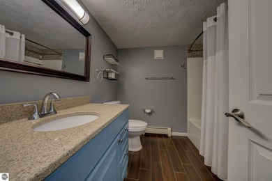 This turnkey lower level condo on 6th fairway of The Crown Golf on Bay Meadows Golf Course - Executive in Michigan - for sale on GolfHomes.com, golf home, golf lot