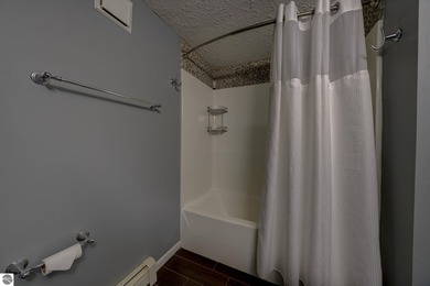 This turnkey lower level condo on 6th fairway of The Crown Golf on Bay Meadows Golf Course - Executive in Michigan - for sale on GolfHomes.com, golf home, golf lot