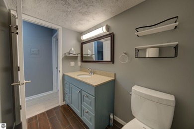 This turnkey lower level condo on 6th fairway of The Crown Golf on Bay Meadows Golf Course - Executive in Michigan - for sale on GolfHomes.com, golf home, golf lot