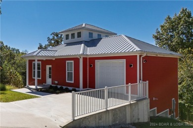 This beautiful 4-bedroom home offers great water views from one on The Oaks Golf Course in Missouri - for sale on GolfHomes.com, golf home, golf lot