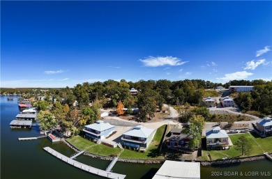 This beautiful 4-bedroom home offers great water views from one on The Oaks Golf Course in Missouri - for sale on GolfHomes.com, golf home, golf lot