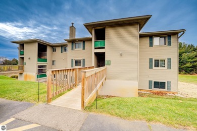 This turnkey lower level condo on 6th fairway of The Crown Golf on Bay Meadows Golf Course - Executive in Michigan - for sale on GolfHomes.com, golf home, golf lot