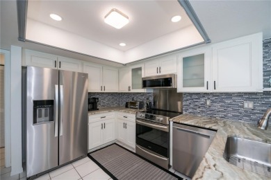 BEAUTIFULLY UPDATED POOL HOME on a large private, oversized on Pinemoor West Golf Club in Florida - for sale on GolfHomes.com, golf home, golf lot