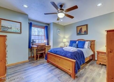 This beautiful contemporary home is a great investment property on Pocono Farms Country Club in Pennsylvania - for sale on GolfHomes.com, golf home, golf lot