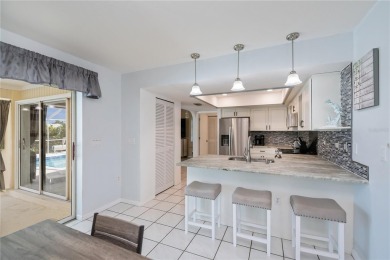 BEAUTIFULLY UPDATED POOL HOME on a large private, oversized on Pinemoor West Golf Club in Florida - for sale on GolfHomes.com, golf home, golf lot