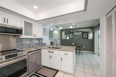 BEAUTIFULLY UPDATED POOL HOME on a large private, oversized on Pinemoor West Golf Club in Florida - for sale on GolfHomes.com, golf home, golf lot