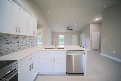 BRAND NEW CONSTRUCTION ON AN OVERSIZED LOT WITH SPINKLERS! You on Mirror Lakes Golf Club in Florida - for sale on GolfHomes.com, golf home, golf lot