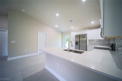 BRAND NEW CONSTRUCTION ON AN OVERSIZED LOT WITH SPINKLERS! You on Mirror Lakes Golf Club in Florida - for sale on GolfHomes.com, golf home, golf lot