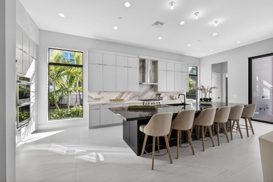 Set on an estate lot within Avenir's most luxurious gated on Palm Beach Gardens Golf Course in Florida - for sale on GolfHomes.com, golf home, golf lot