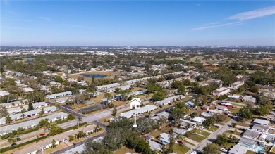 Nestled in the highly desirable 55+ community of Bardmoor, this on Bayou Golf Club in Florida - for sale on GolfHomes.com, golf home, golf lot