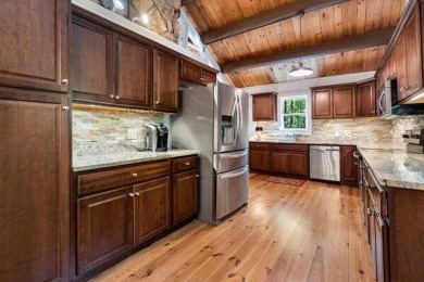 This is a light and bright, fully renovated, real log cabin in on Big Canoe Golf Club - Cherokee in Georgia - for sale on GolfHomes.com, golf home, golf lot